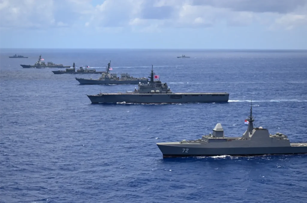 Multinational ships sail in formation during RIMPAC 2024
