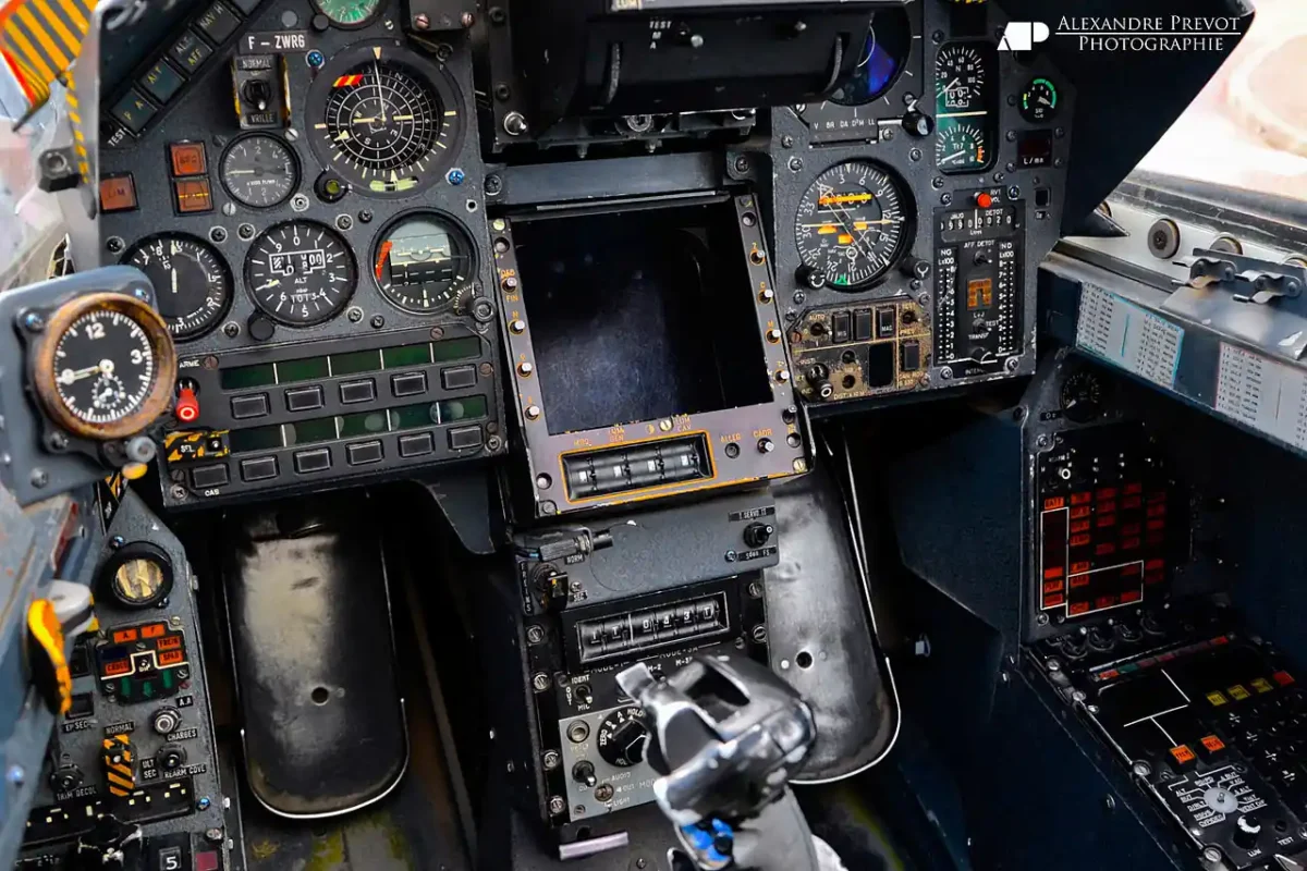 Mirage 2000 cockpit showing instrument panels and navigation screens.