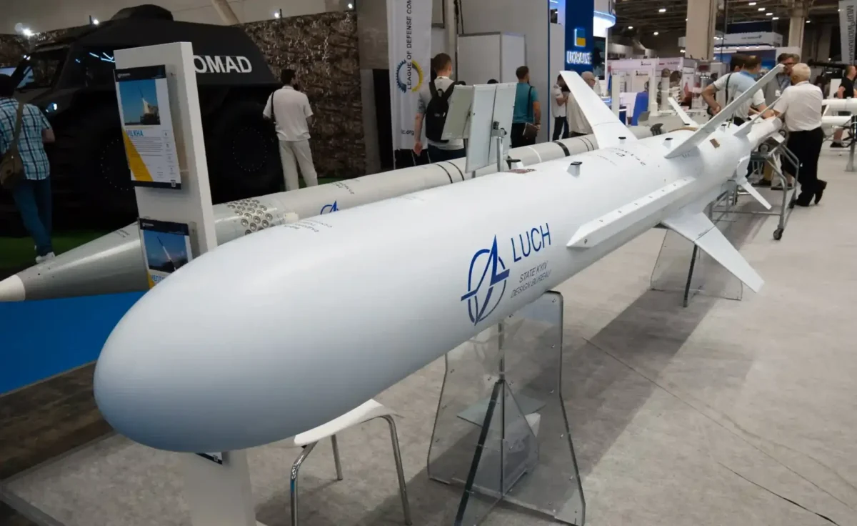 Neptune missile displayed at Arms and Security exhibition, showing launcher vehicle and missile.