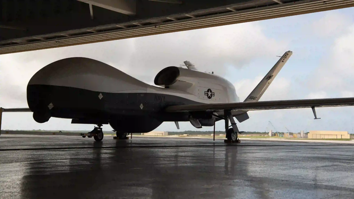 An MQ-4C Triton in a hangar at Andersen Air Force Base for early operational testing by VUP-19.