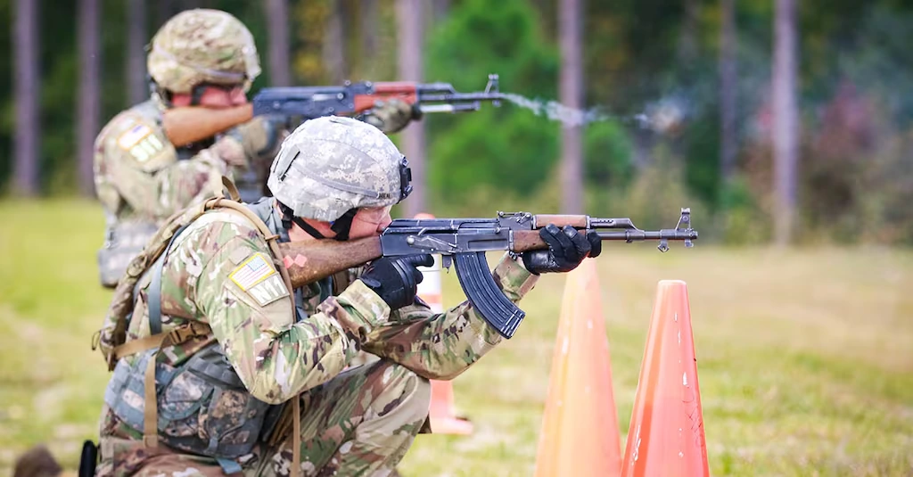 soldiers fire AK-47 assault rifles